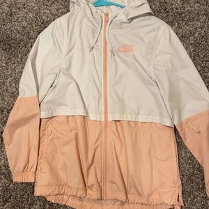 a pink and white nike wind breaker jacket